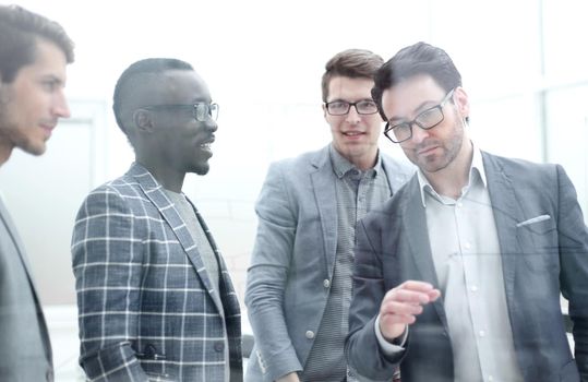 businessman discussing with the business team a new strategy of the company. business concept
