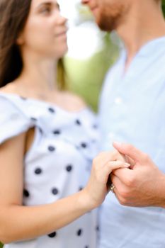 Husband holding wife hand and dancing. Concept of married couple and love.