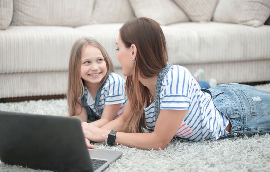 mom and daughter spend a free evening together.people and technology