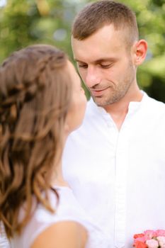 Happy groom in white shirt with caucasian bride. Concept of married couple and love.