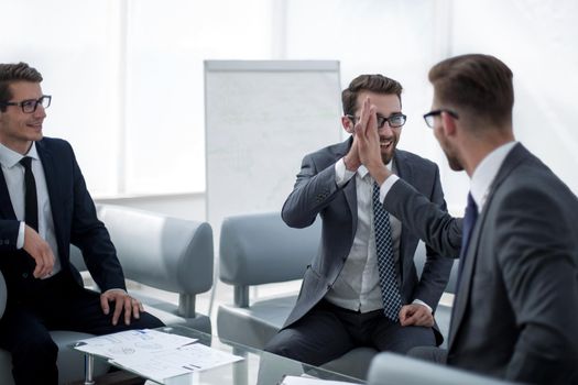 business partners talking at the office Desk in the business center