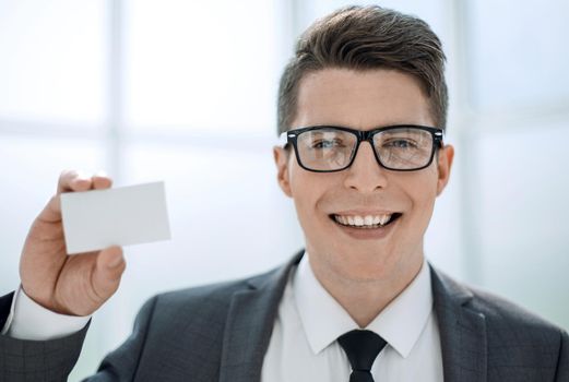 close up.businessman showing his business card.photo with space for text