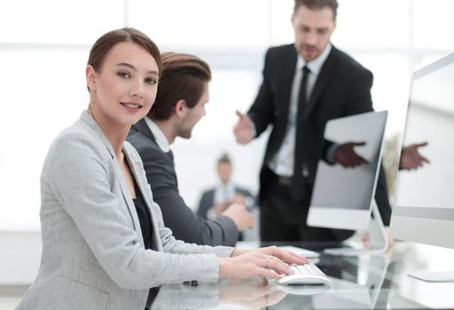 young employee sitting at his Desk.the concept of teamwork