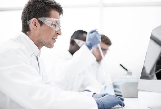 group of scientists conduct research in the laboratory. photo with copy space