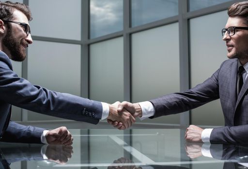 close up.business handshake over the Desk.photo with copy space