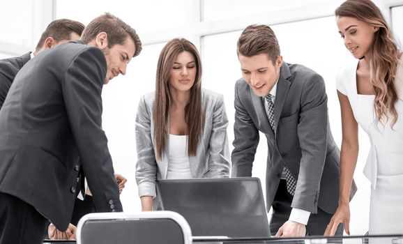 business team looking at the laptop screen.the concept of teamwork