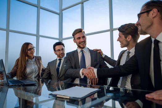 stock traders analyzing market, pointing at charts on monitor.