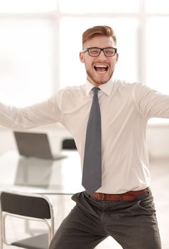 very happy businessman on office background.photo with copy space