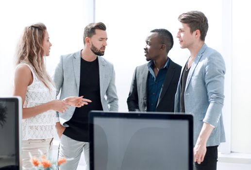 business team talking standing in the office.photo with copy space