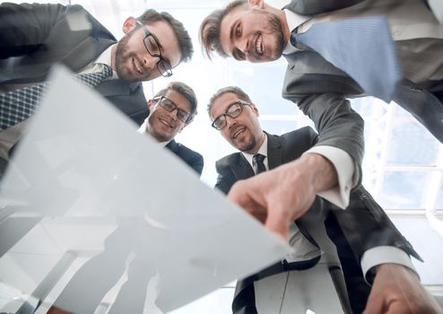 bottom view.business team discussing the terms of the contract .business concept