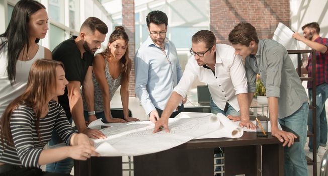 businessman discussing with the design team new sketches.business concept