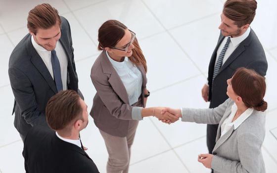 top view.handshake of two business women before the meeting.concept of partnership