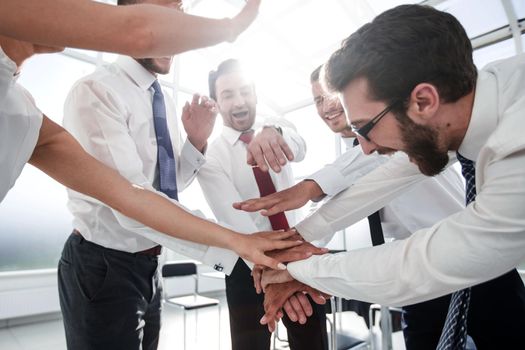 close up.the business team connects their hands together