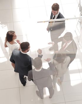 top view. business partners stretching out their hands for a handshake.business background