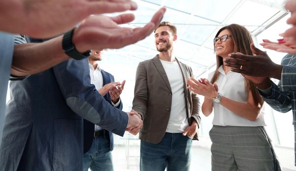business team applauds business partners .the concept of cooperation