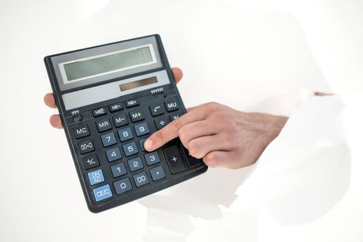 close up.businessman pressing the buttons of the calculator.business concept