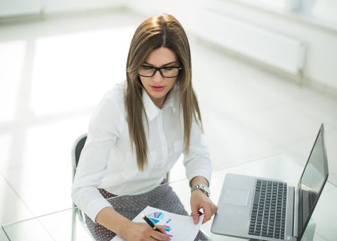 business woman checking financial documents.photo with text space