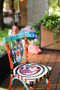 Painted chair at cafe. Concept of handmade.