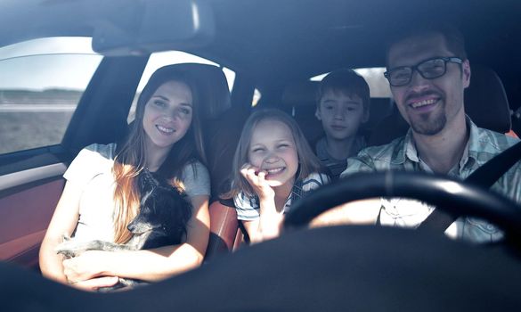 happy family rides in the car.the concept of freedom and travel