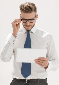 close up. businessman looking at the digital tablet screen. people and technology