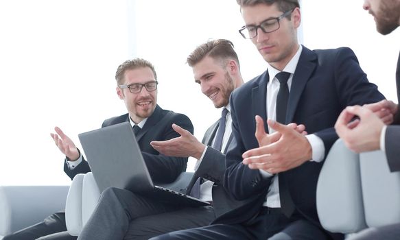 group of business people talking sitting in the office waiting room .business concept