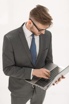 close up.businessman testing a new laptop.isolated on white