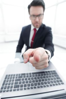 close up.image of a confident businessman pointing at you.business background