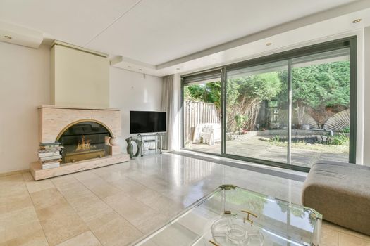 Room with big sliding glass doors and fireplace