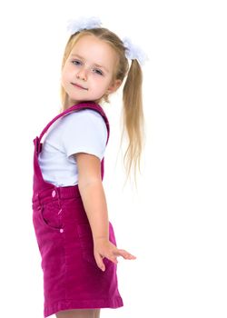 Beautiful little girl posing in the studio on a white background. The concept of style and fashion. Isolated on white background.