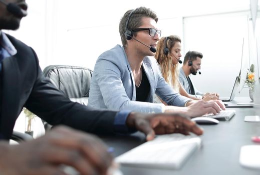 call center staff work in a modern office. photo with copy space