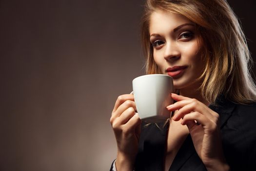 Coffee. Beautiful Girl Drinking Tea or Coffee. Cup of Hot Beverage