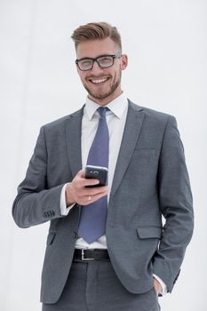 successful businessman with a smartphone.isolated on white