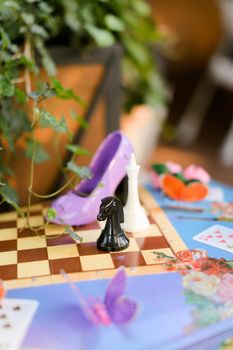 Children playground with chess and cards at cafe.