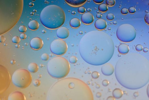 Oil drops in water. Abstract psychedelic pattern image multicolored. Abstract background with colorful gradient colors. Dof.