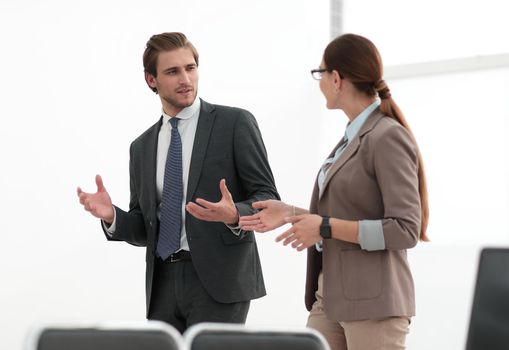 business colleagues talk in a modern office.photo with copy space