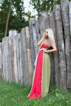 Sexy woman outdoor with nice colorful dress. Fashion