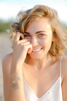 Close up portrait of young blonde lady without makeup. Concept of natural beauty and feamale person.