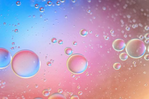 Oil drops in water. Abstract psychedelic pattern image multicolored. Abstract background with colorful gradient colors. Dof.