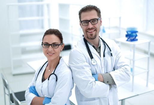 portrait of two young scientists on the background of the laboratory