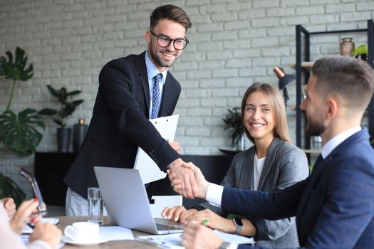 Business people shaking hands, finishing up a meeting