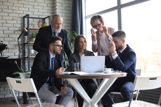 Portrait of a positive business employees at an office business meeting