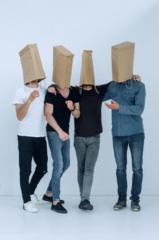 in full growth. a group of men with paper bags on their heads.photo with copy space