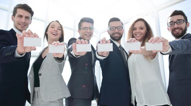 business team showing their business cards.concept of cooperation