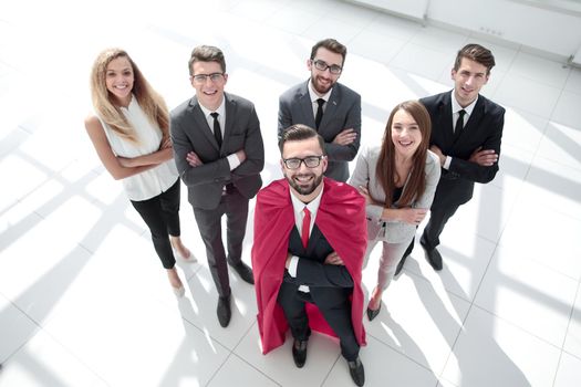 top view.businessman-Superman and his business team standing together.business concept