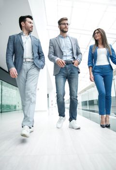 in full growth.a group of business people in the office hall