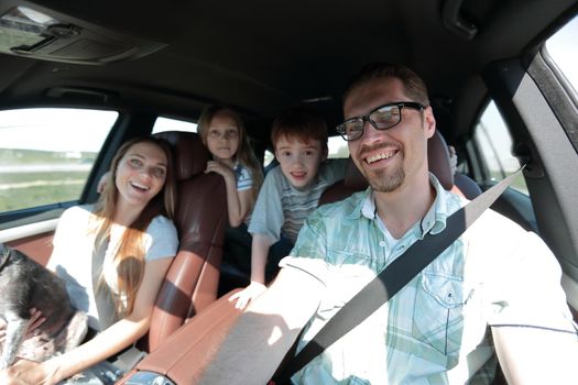 close-knit family with two children traveling in the car.the concept of freedom and travel