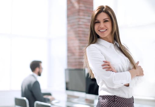 young confident business woman on the background of the office.photo with copy space