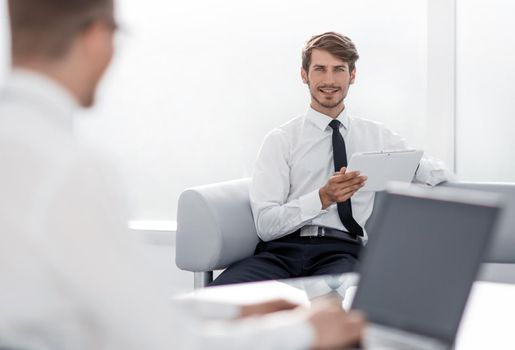 Two businessmen negotiating sitting at table, business partners working together, preparing business offer