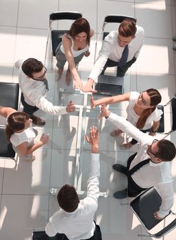 top view.employees of the company showing their unity.the concept of teamwork
