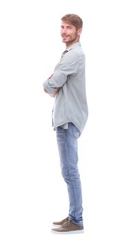 side view. confident young man in jeans . isolated on white background